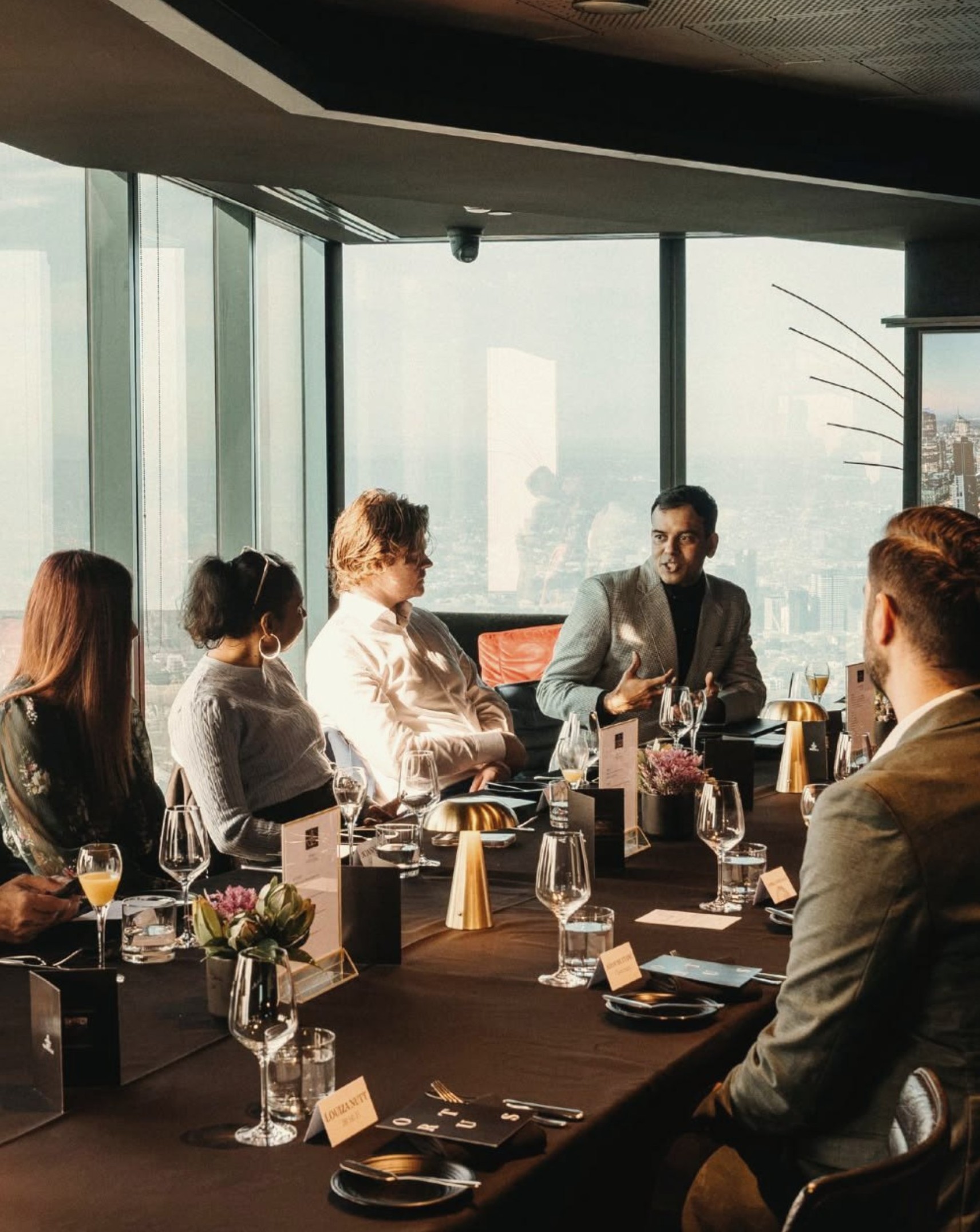 Members in conversation over lunch